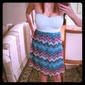 Strapless dress with multi color zig zag skirt